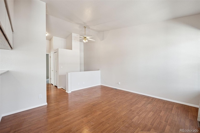 6087 Colony Cir, Colorado Springs, CO 80919 - spare room featuring a ceiling fan, wood finished floors, baseboards, and lofted ceiling
