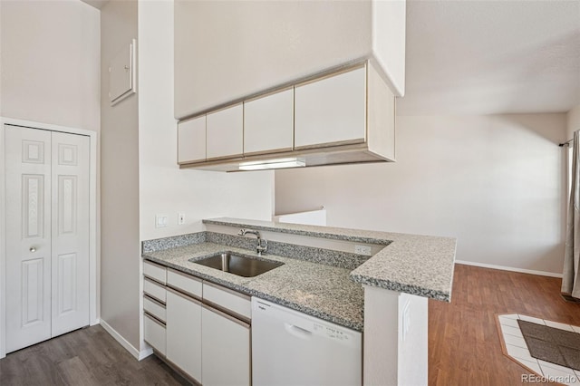 6087 Colony Cir, Colorado Springs, CO 80919 - kitchen featuring a sink, white dishwasher, dark wood-style floors, white cabinets, and light stone countertops