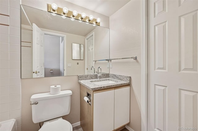 6087 Colony Cir, Colorado Springs, CO 80919 - full bathroom with vanity, toilet, and baseboards
