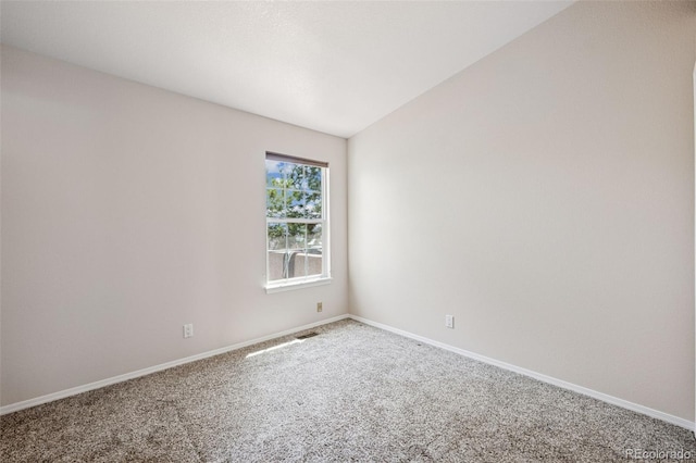 6087 Colony Cir, Colorado Springs, CO 80919 - spare room with carpet floors, lofted ceiling, and baseboards