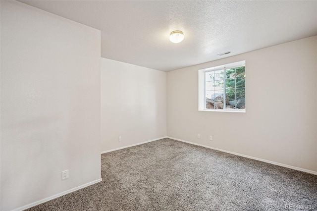 6087 Colony Cir, Colorado Springs, CO 80919 - spare room with carpet flooring, baseboards, and a textured ceiling