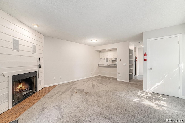 carpeted living room with a textured ceiling