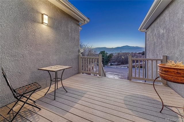 deck at dusk with a mountain view