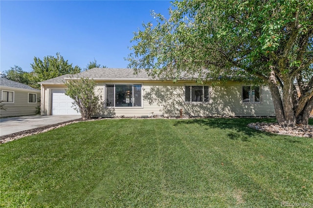 single story home featuring a garage, a front yard, and concrete driveway