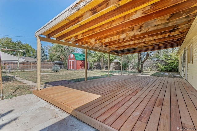 wooden deck featuring a shed