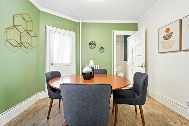 1137 N Sherman St Unit 17, Denver, CO 80203 - dining space featuring wood finished floors and ornamental molding