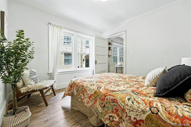 1137 N Sherman St Unit 17, Denver, CO 80203 - bedroom featuring crown molding and wood finished floors