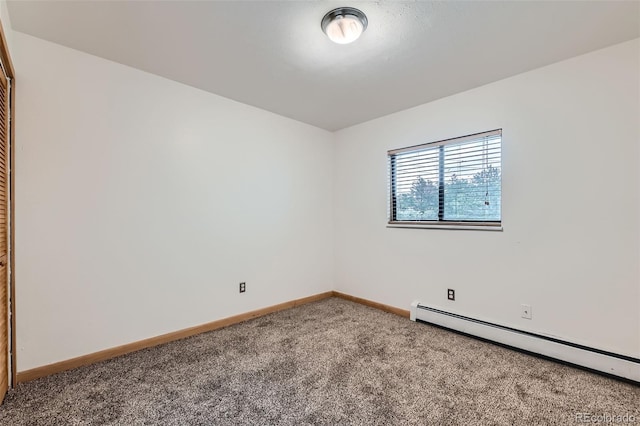 695 Manhattan Dr Unit 109, Boulder, CO 80303 - empty room with a baseboard heating unit, carpet floors, and baseboards