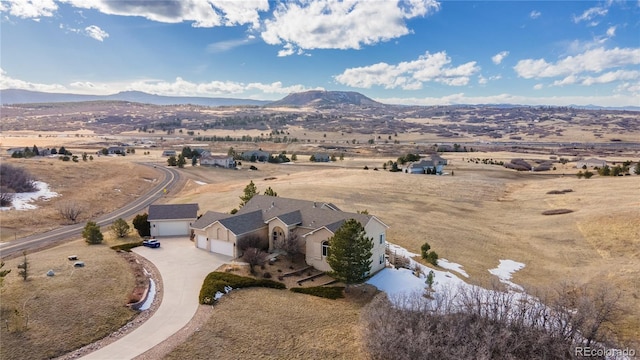 birds eye view of property with a mountain view