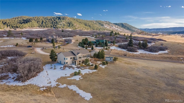 birds eye view of property featuring a mountain view