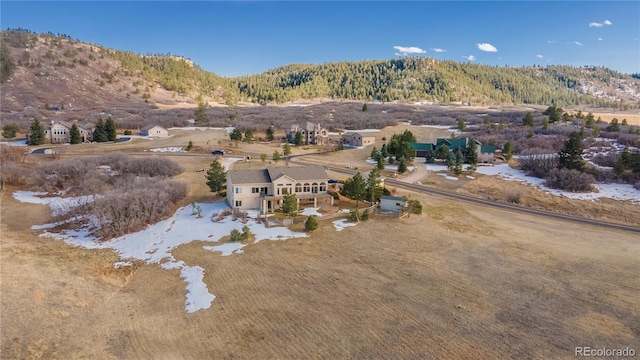 drone / aerial view featuring a mountain view