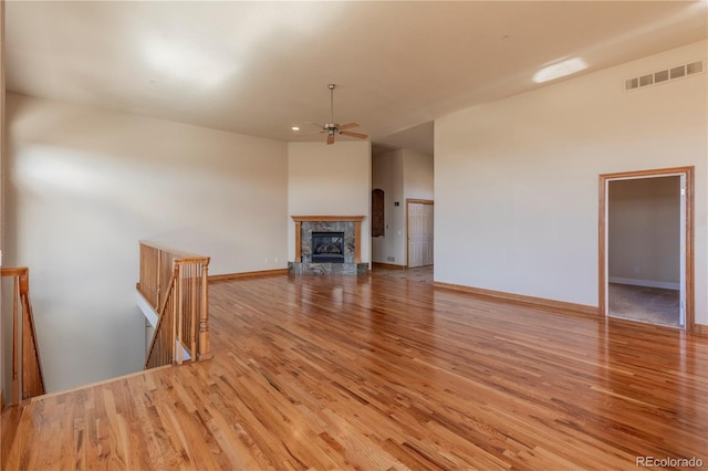 unfurnished living room featuring light hardwood / wood-style floors and ceiling fan