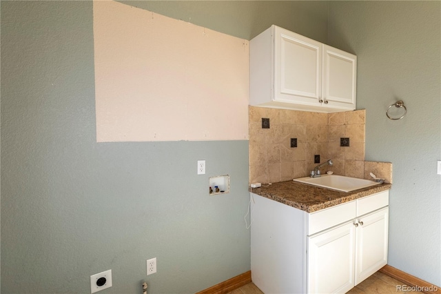 clothes washing area featuring washer hookup, electric dryer hookup, and sink