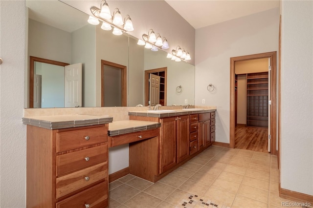 bathroom with hardwood / wood-style floors and double vanity