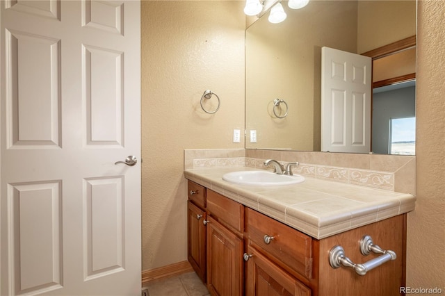 bathroom featuring vanity and tile floors