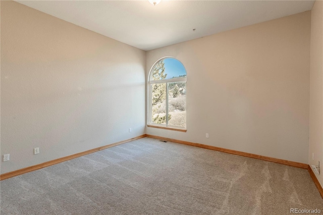 unfurnished room with carpet floors