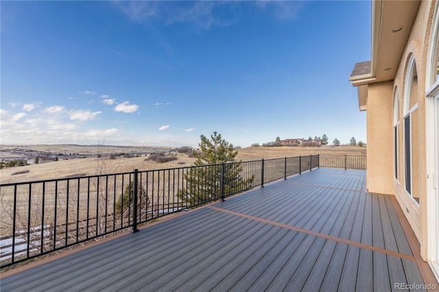 wooden terrace featuring a rural view