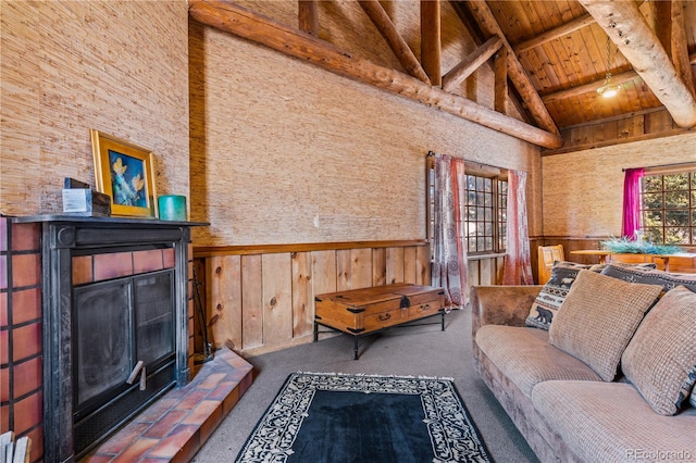 living room with beamed ceiling, wood ceiling, wood walls, and high vaulted ceiling