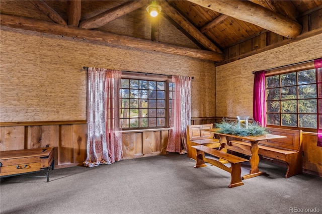 interior space with wood ceiling, wooden walls, beam ceiling, and high vaulted ceiling