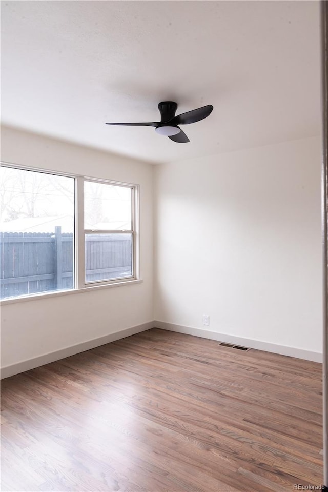 unfurnished room with light hardwood / wood-style floors and ceiling fan