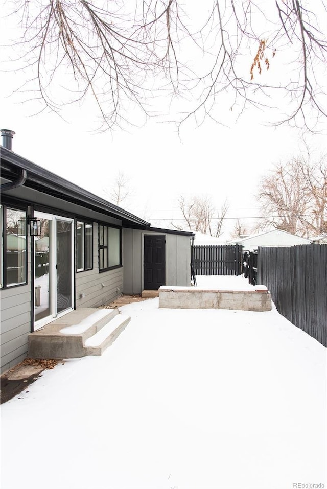 view of yard layered in snow