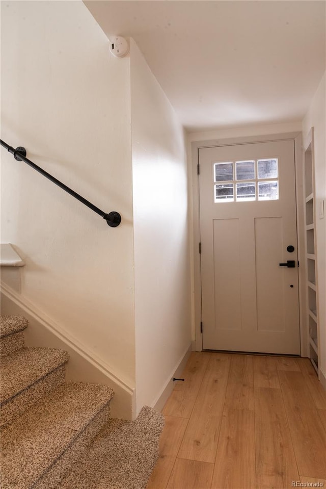 doorway with light hardwood / wood-style floors