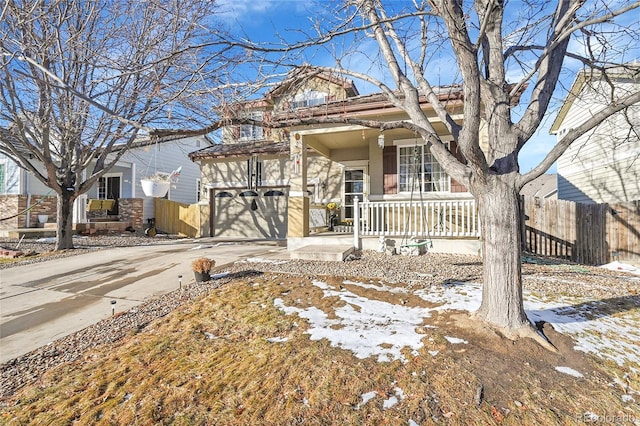 view of front of home featuring a garage and covered porch