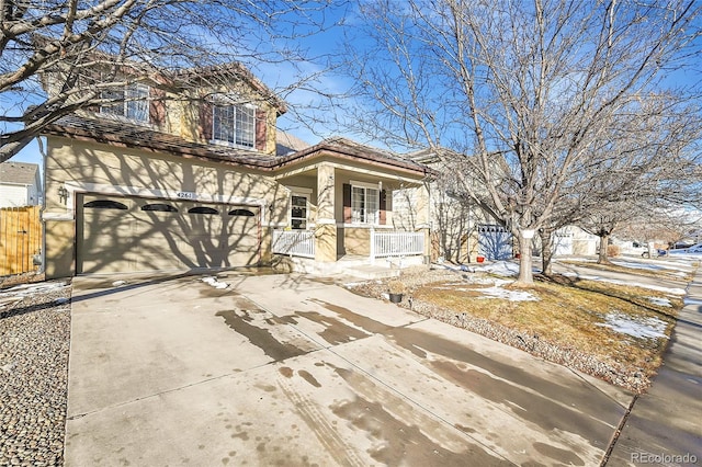 view of front of property with a porch and a garage