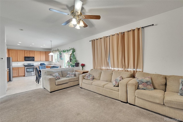 living room featuring light colored carpet and ceiling fan