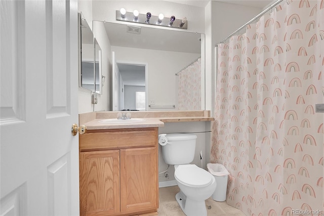 bathroom featuring vanity, toilet, and a shower with shower curtain