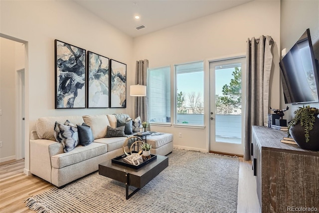 living room with light hardwood / wood-style floors