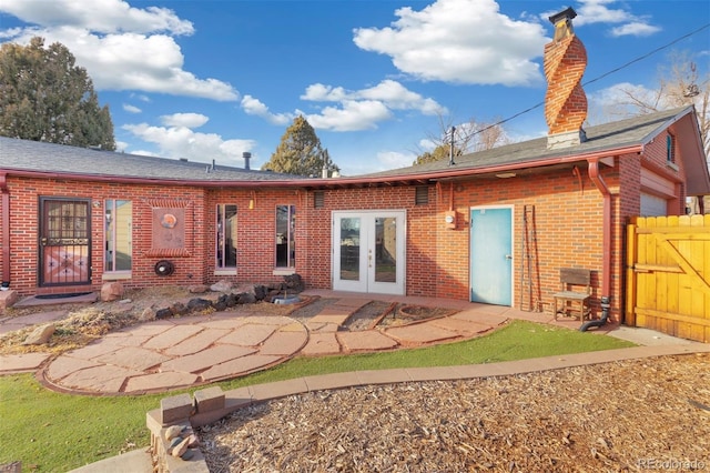 rear view of property featuring a patio area and french doors