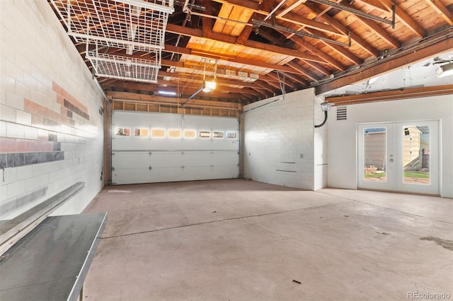 garage featuring wooden ceiling and french doors