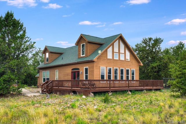 back of house with a wooden deck