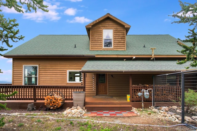 view of front of home featuring a porch and central AC