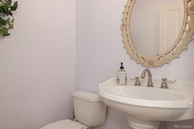 bathroom with sink and toilet