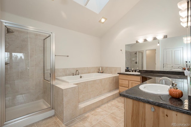 bathroom with a skylight, vanity, high vaulted ceiling, independent shower and bath, and tile patterned flooring