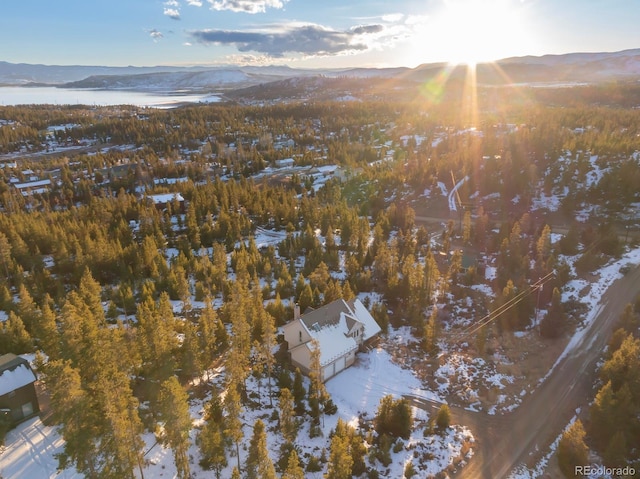 snowy aerial view featuring a mountain view