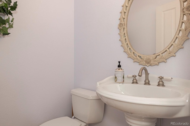 bathroom with a sink and toilet