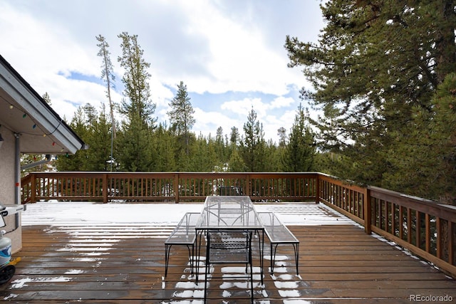 deck with outdoor dining area