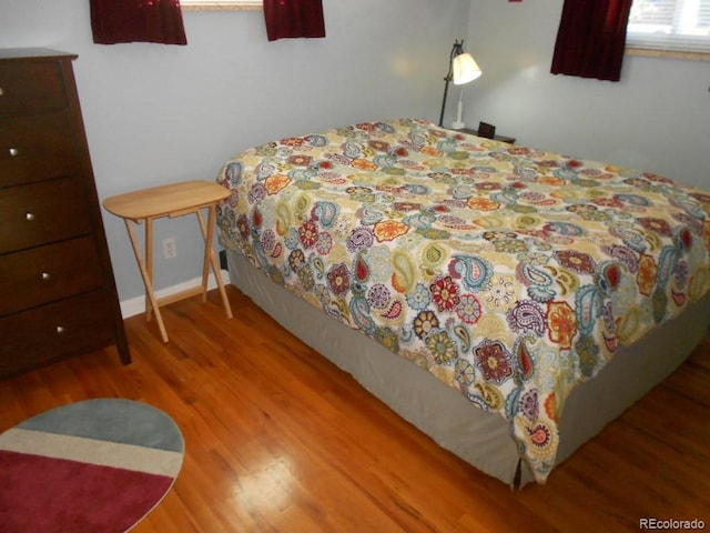 bedroom featuring wood-type flooring