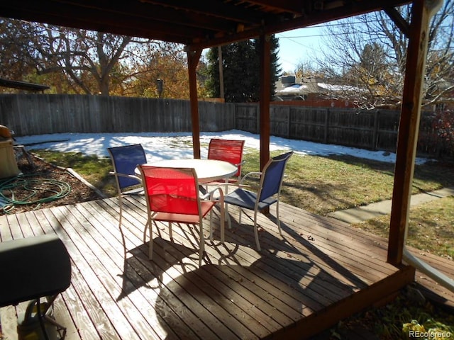 wooden deck featuring a yard