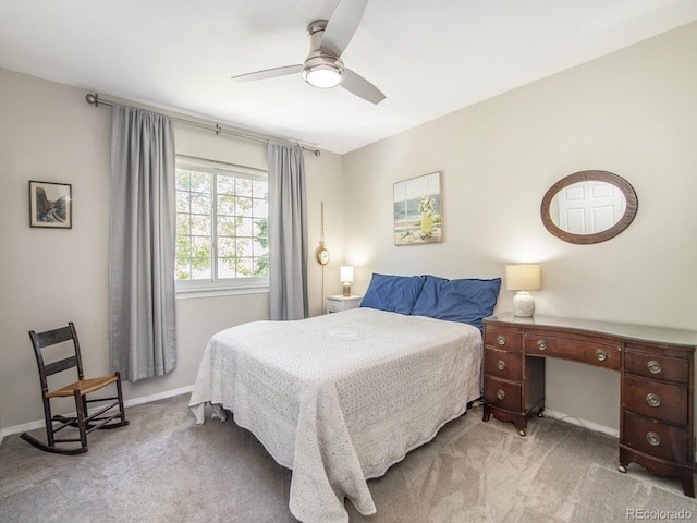 bedroom featuring ceiling fan and light colored carpet