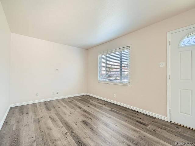 entryway with hardwood / wood-style flooring