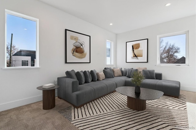 living room featuring recessed lighting, baseboards, plenty of natural light, and carpet