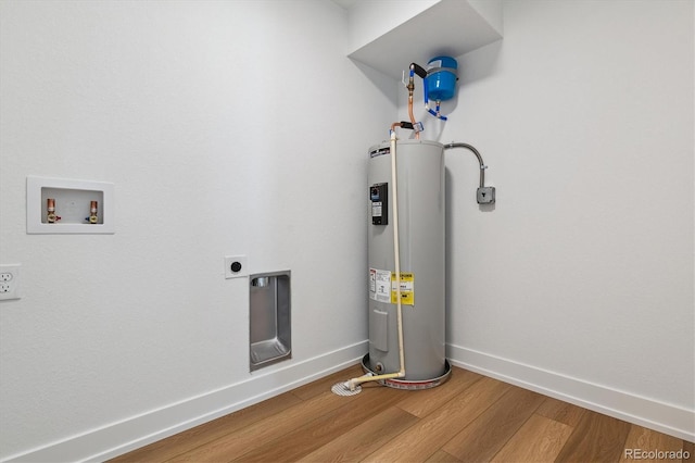 utility room featuring water heater