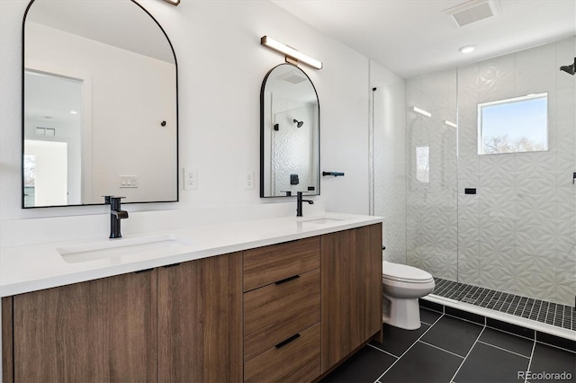 full bath featuring tile patterned flooring, toilet, visible vents, and a sink