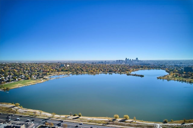 birds eye view of property featuring a view of city and a water view