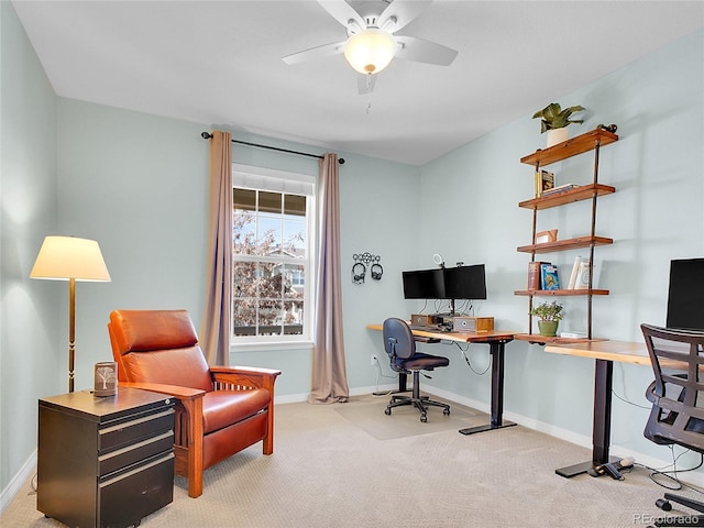 office area with carpet floors, baseboards, and a ceiling fan