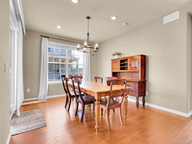 dining room with recessed lighting, visible vents, an inviting chandelier, light wood-style floors, and baseboards